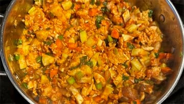 Vegan sausage added to pot.