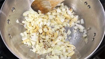 Onions sauteing in pan.