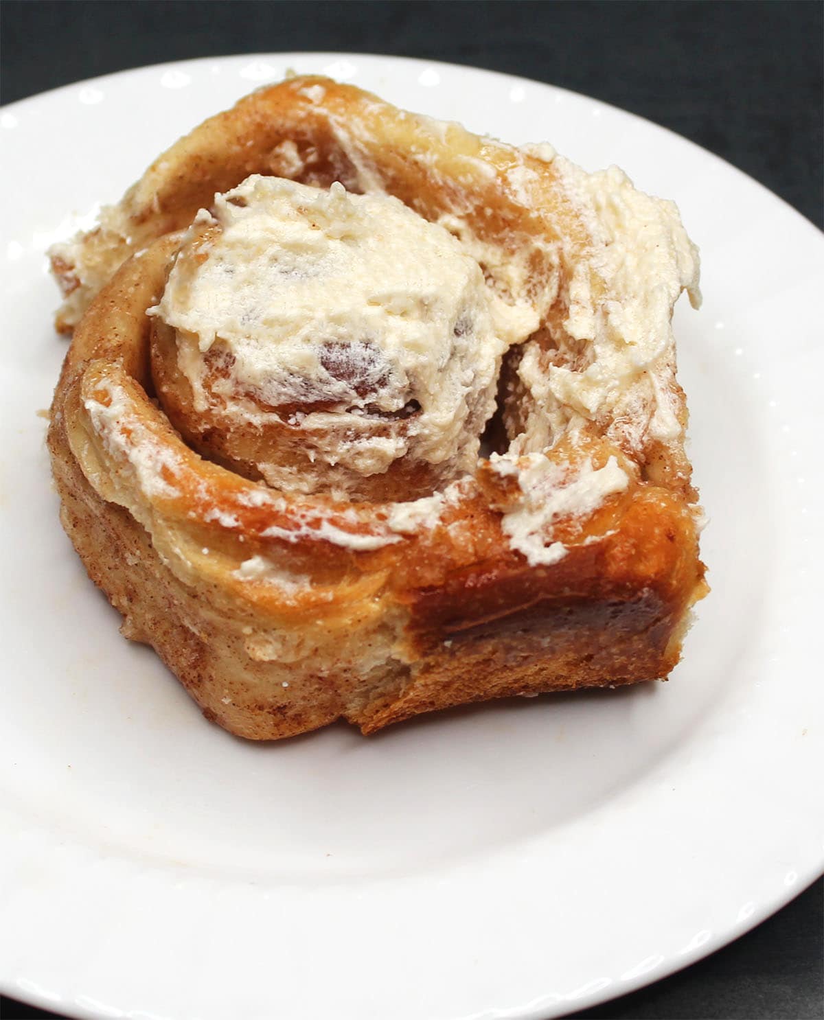 Sourdough cinnamon roll on plate.