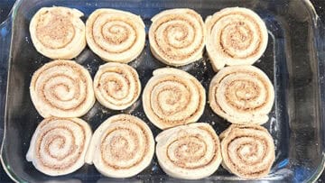 Cinnamon rolls in baking dish before proofing.