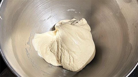 Cinnamon roll dough kneaded until smooth and supple.