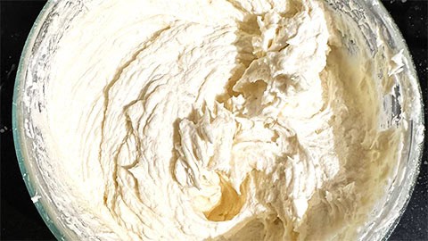 Vegan cream cheese icing in bowl.