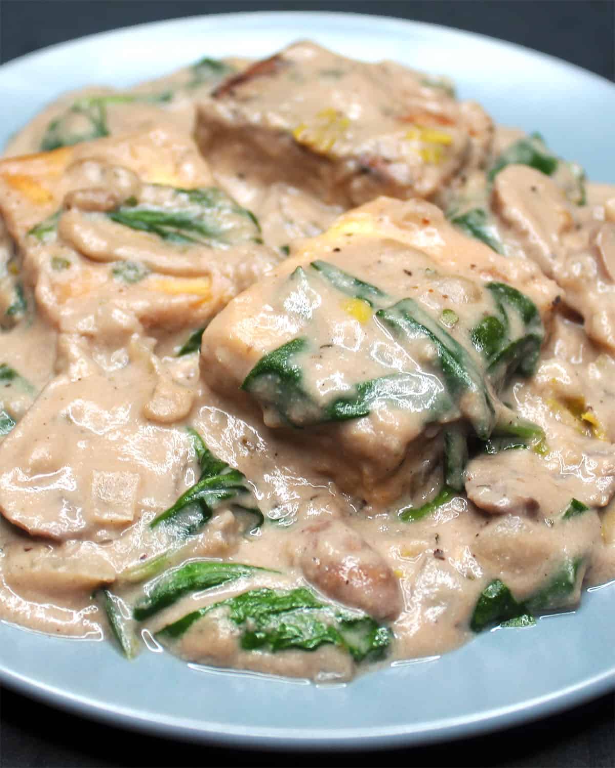 Vegan tofu florentine in gray plate.