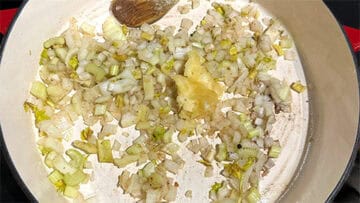 Onions and garlic sauteing in olive oil.