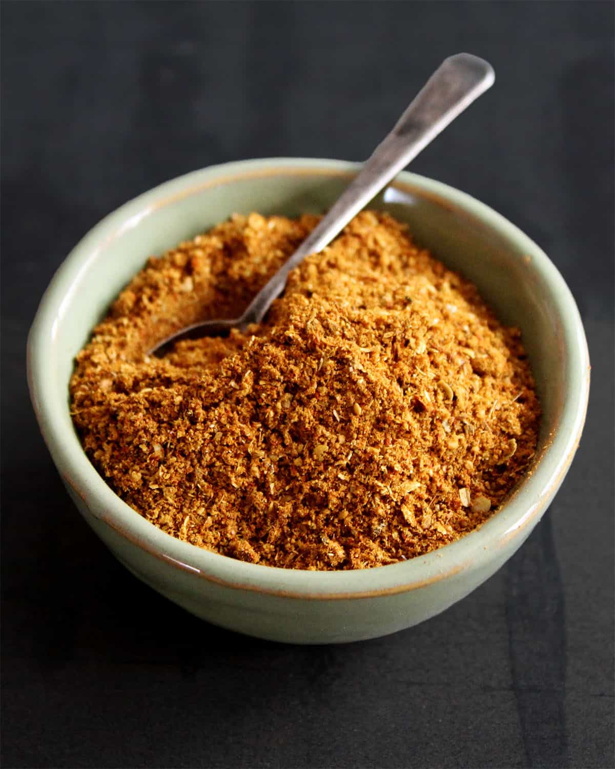 Pav bhaji masala in bowl with spoon.