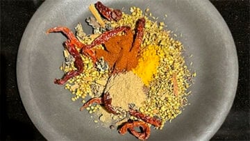 Spices with paprika, turmeric and amchur powders added.