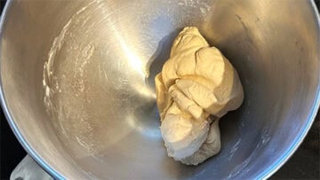Kneaded dough in bowl.