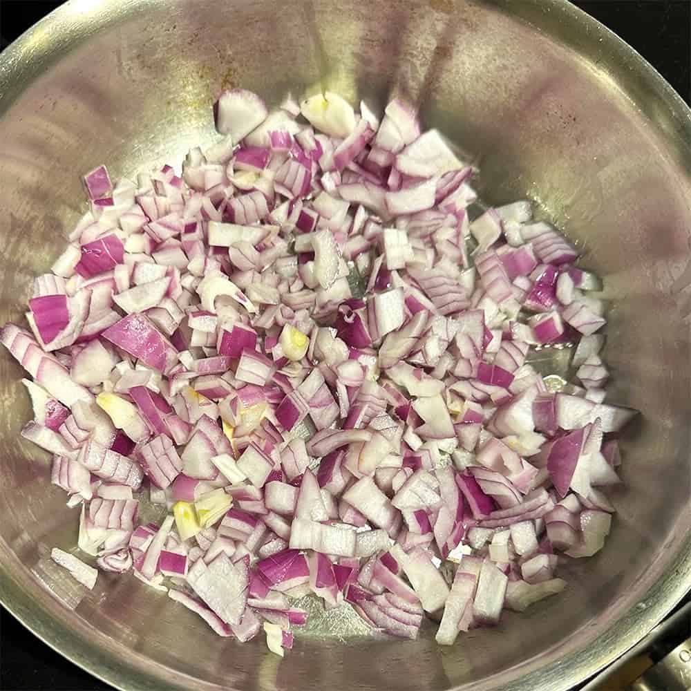 Onions sauteing in pan.