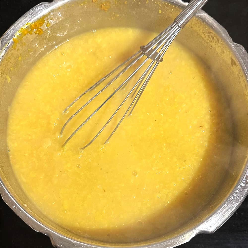 Masoor dal and toor dal cooked with turmeric and whisked.