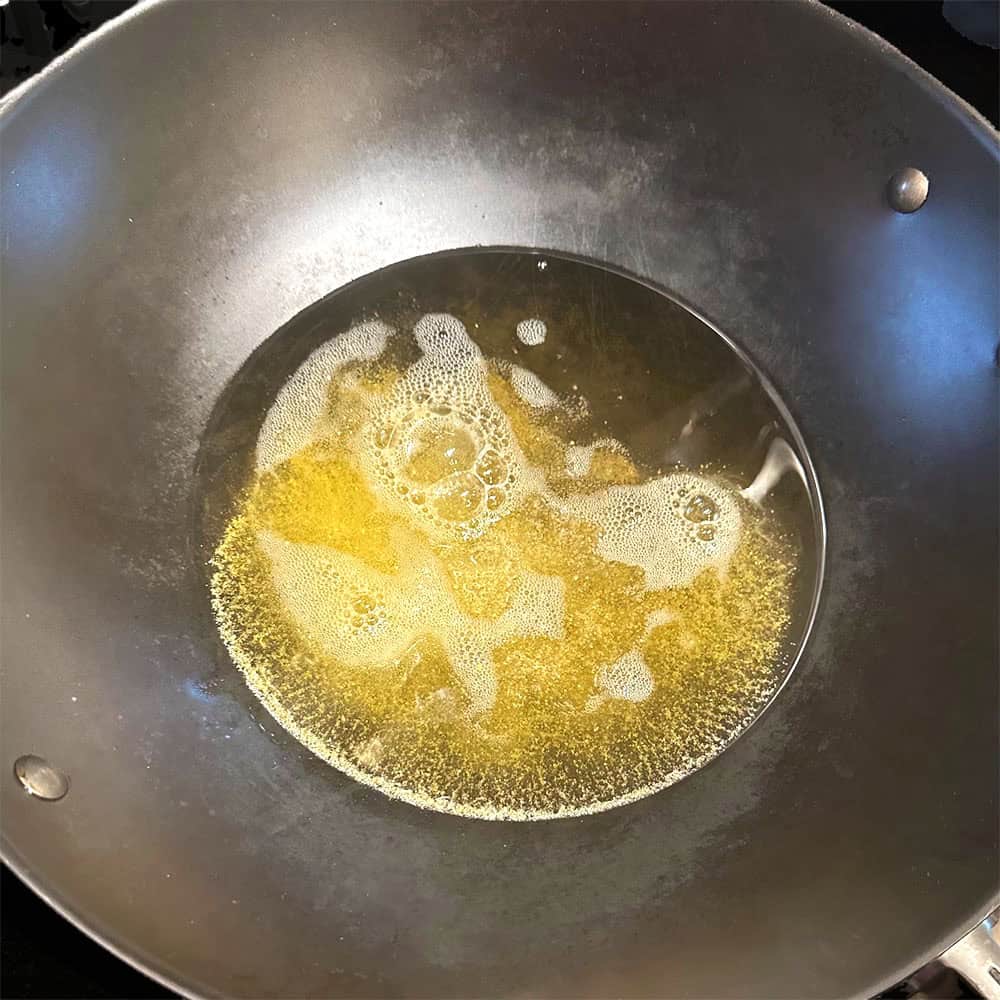 Mustard seeds and asafetida in oil.