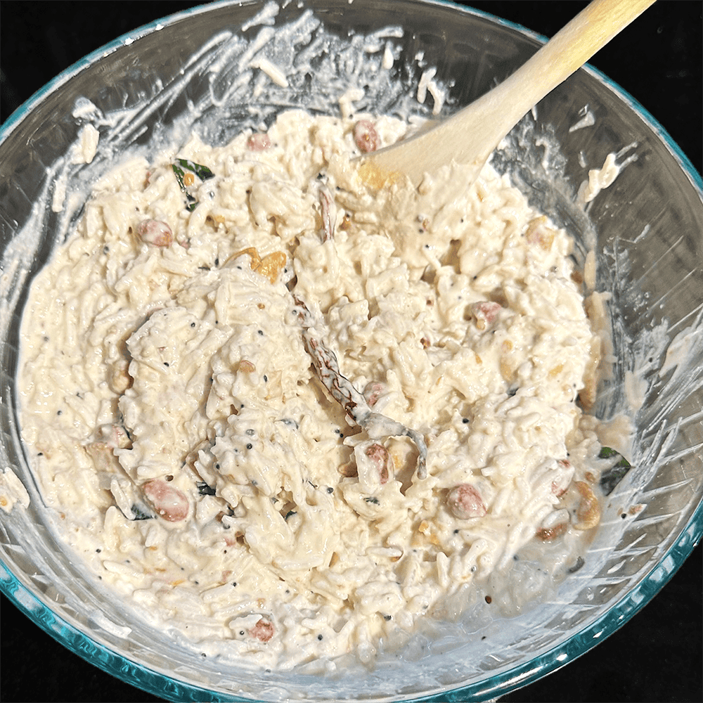 Curd rice mixed in a bowl.