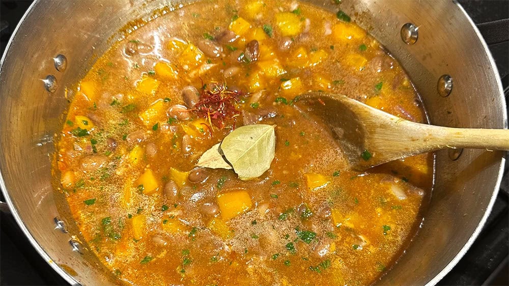 Bay leaves and saffron added to beans.