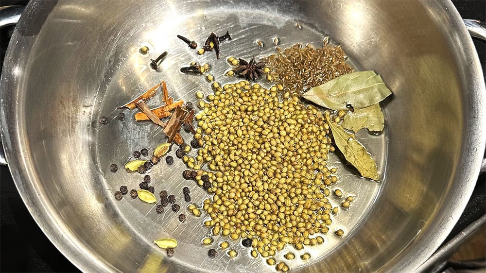Spices toasting in pan for misal curry.