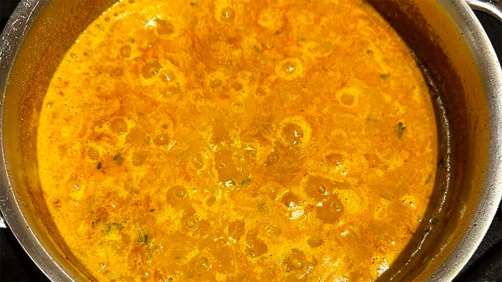 Oil separated at top of misal curry.