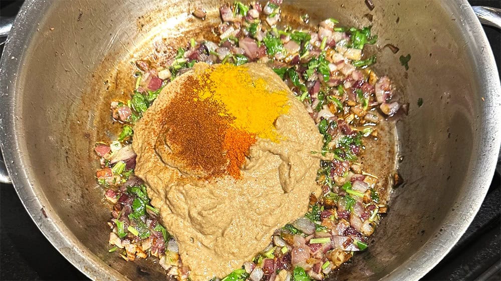 Masala, cayenne and paprika in pan.