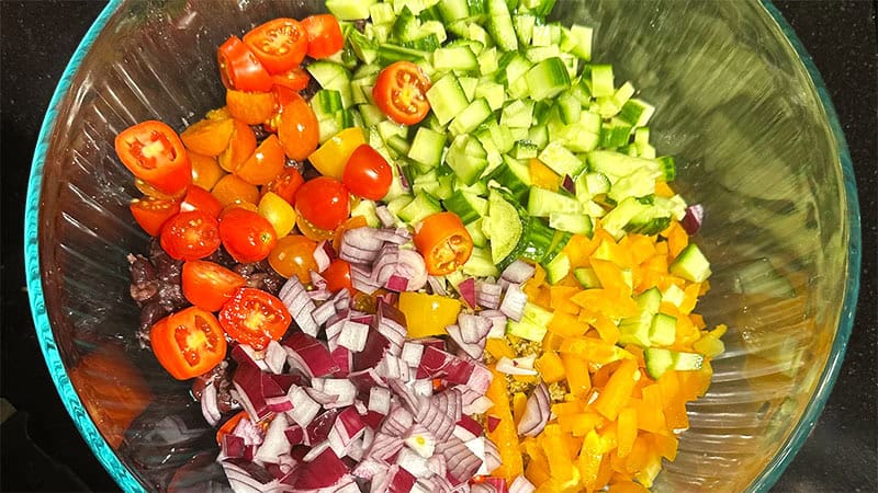 Vegetables for kidney beans salad in large bowl.