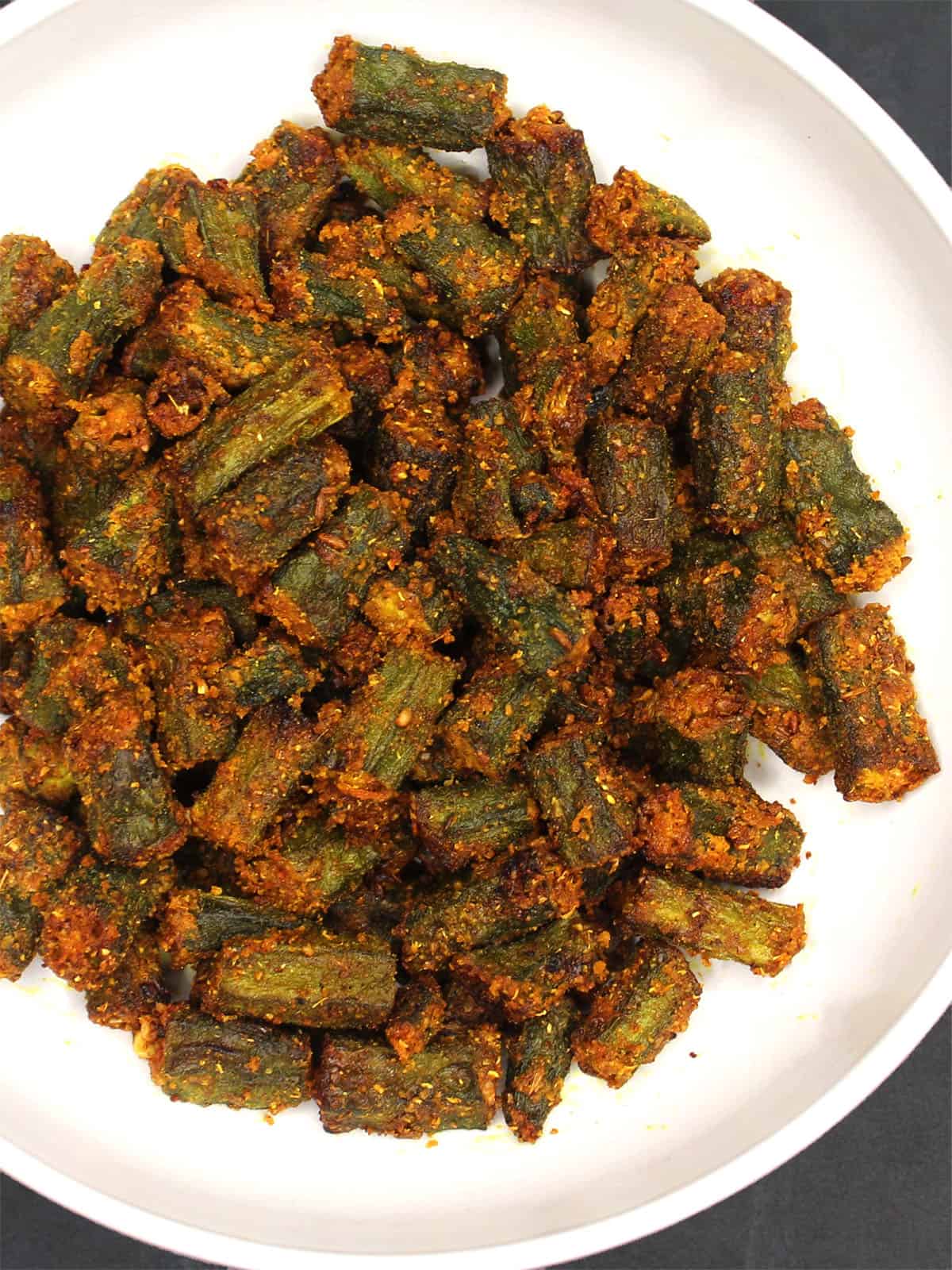 Crispy air fryer okra in a white bowl.