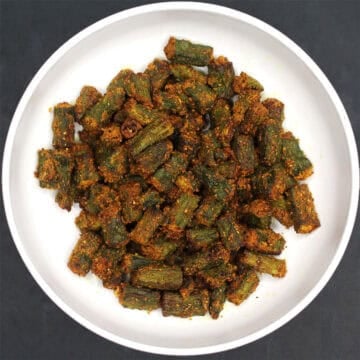 Crispy air fryer okra in white bowl.