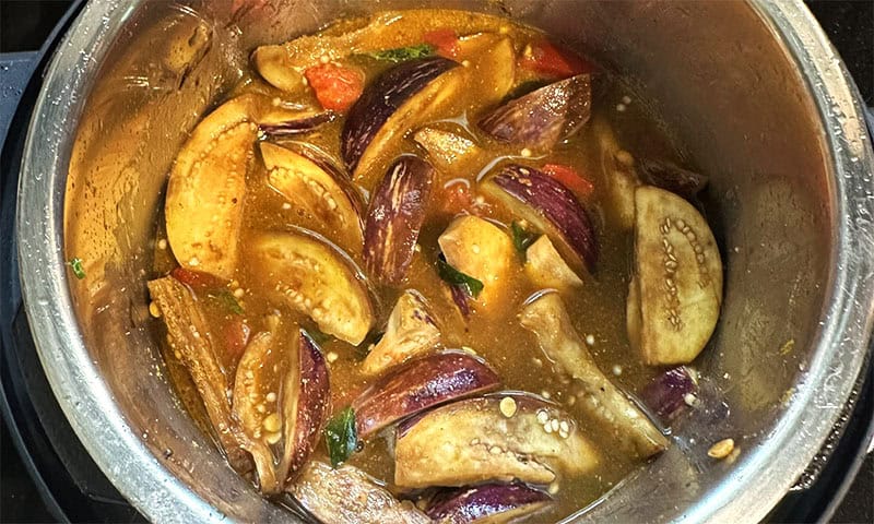 Water mixed into sambar ingredients before cooking.