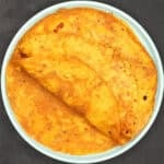 Overhead shot of pumpkin parathas in plate.