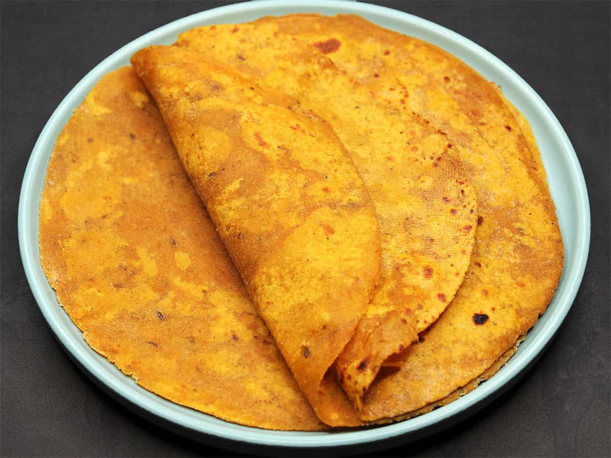Front view of pumpkin paratha on plate.
