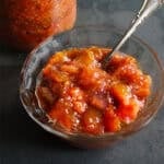 Fig jam in bowl with spoon.